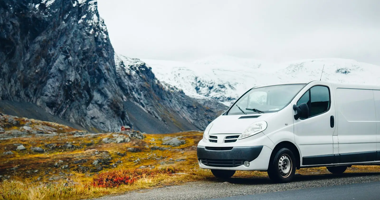 White van on a mountain road in Norway