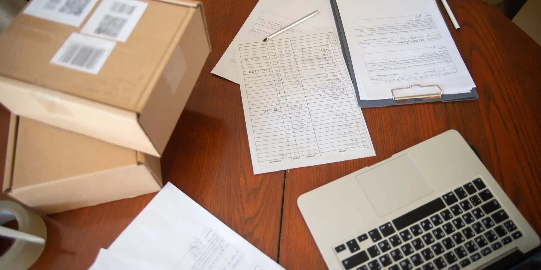 Commercial invoice and freight documents on a desk